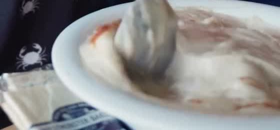 A spoonful of cream of crab soup, dusted with Old Bay — Bowl #848 at Koco's Pub